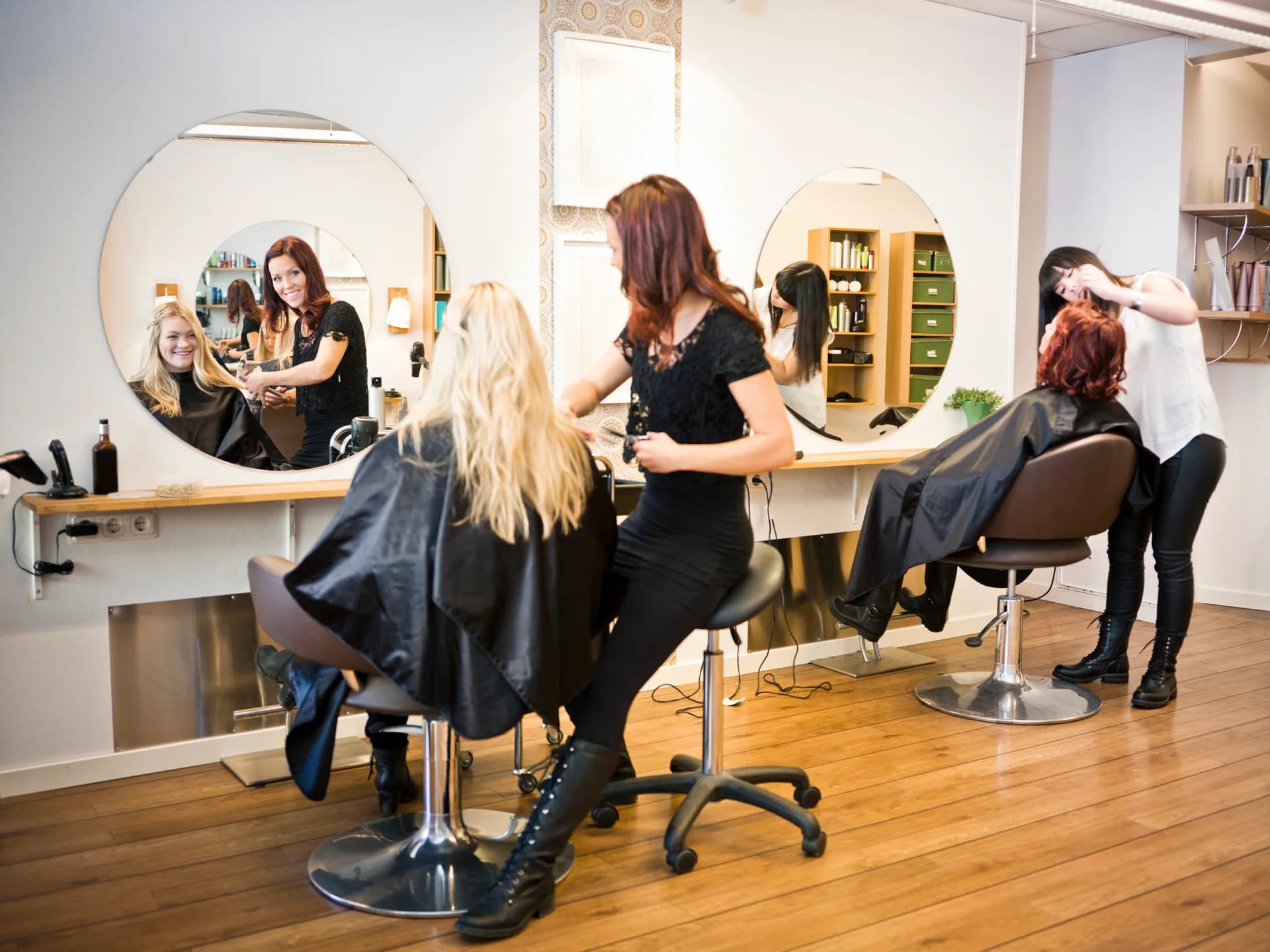 Spokane stylists at work at mirrored salon stations